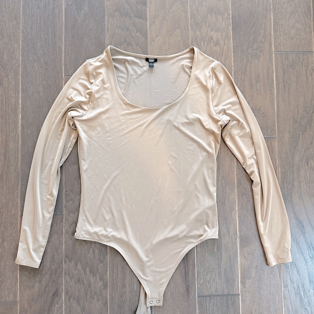 Large, long sleeved body suit. Soft purple.